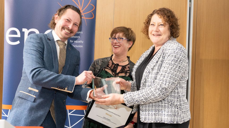 Representative from Balfour Beatty accepting an award from James from HeX. Gemma hovers awkwardly in the background, looking unsure if she wants to be in the photo but looking stunning nonetheless.