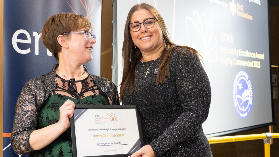 Buckinghamshire Council's account manager, Rebecca Elia, accepts the certificate on their behalf from Head of Marketing, Gemma Wood