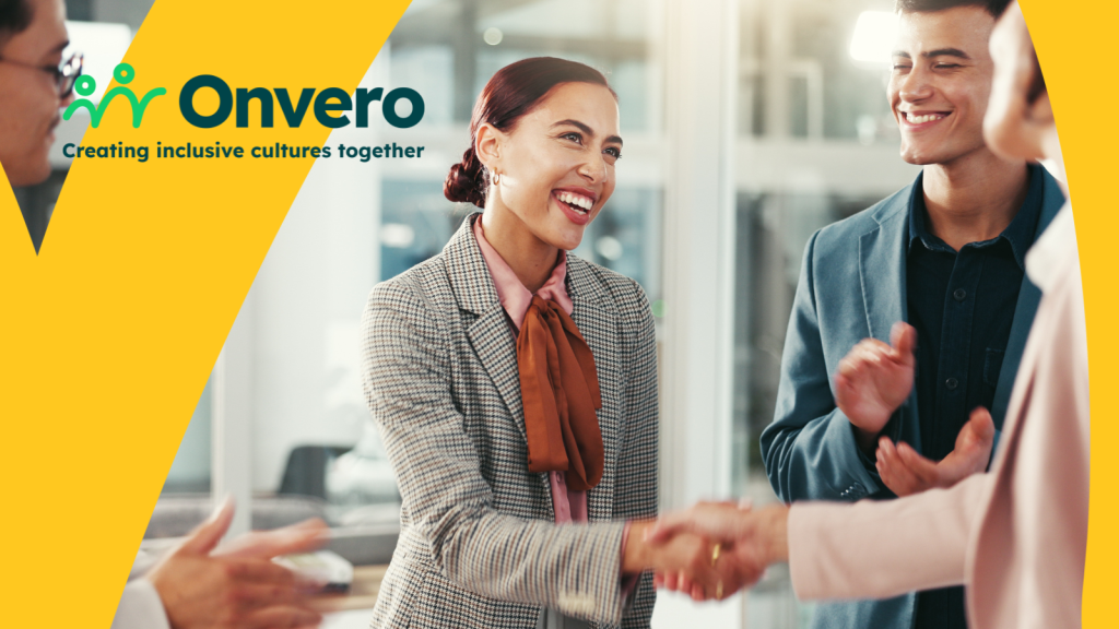 The image shows a female shaking hands with someone out of shot. She smiles broadly, while other people around her are clapping. The Onvero logo appears in the corner.